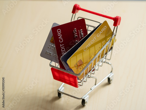 Shopping cart with credit cards online shopping finance modern home close-up consumerism