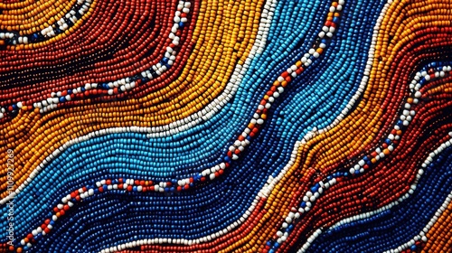 A vibrant, colorful pattern of beads arranged in flowing lines, showcasing intricate designs and rich textures.