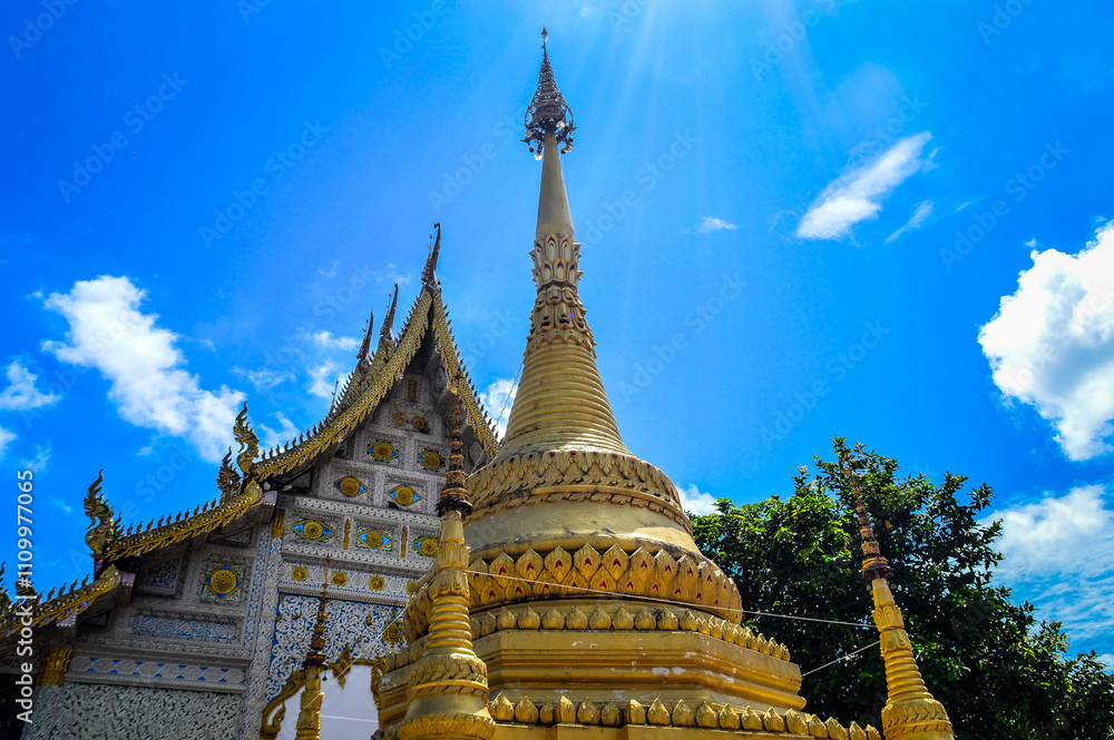 Fototapeta premium Chapel and Gold Pagoda, Lanna Architecture, Symbols of Buddhism, South East Asia at Ko Klang temple, Muang Chiang Mai, Chiang Mai, Northern Thailand