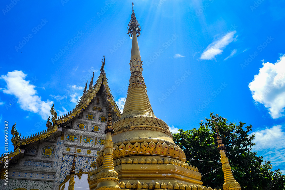 Fototapeta premium Chapel and Gold Pagoda, Lanna Architecture, Symbols of Buddhism, South East Asia at Ko Klang temple, Muang Chiang Mai, Chiang Mai, Northern Thailand