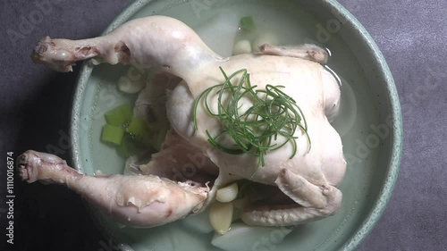 Samgyetang as a nutritious dish. Korean chicken soup with garlic. 
