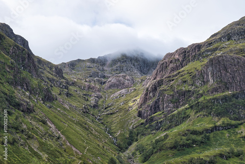 Wallpaper Mural Epic dramatic landscape image of Three Sisters in Glencoe in Scottish Highlands on a wet Summer day. August 2020. This was during the Covid 19 Pandemic . Torontodigital.ca