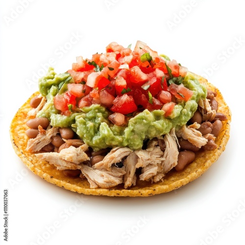 A Tex-Mex chicken tostada with refried beans, guacamole, and salsa photo