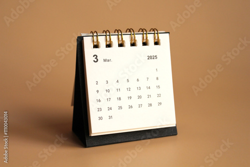 Monthly calendar template for the new year 2025 desk calendar,isolated on Beige background. photo