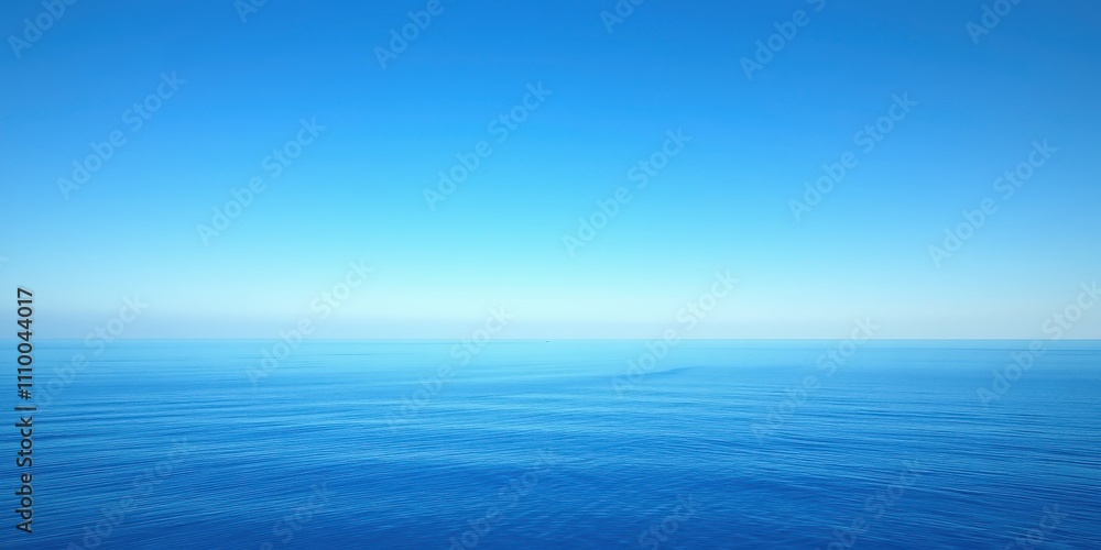 Fototapeta premium Vast blue ocean with a clear, vibrant sky above, showcasing a serene and peaceful atmosphere.