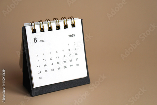 Monthly calendar template for the new year 2025 desk calendar,isolated on Beige background. photo