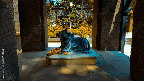 india god nandi statue at outside of the temple at tulapur in maharashtra in india. photo