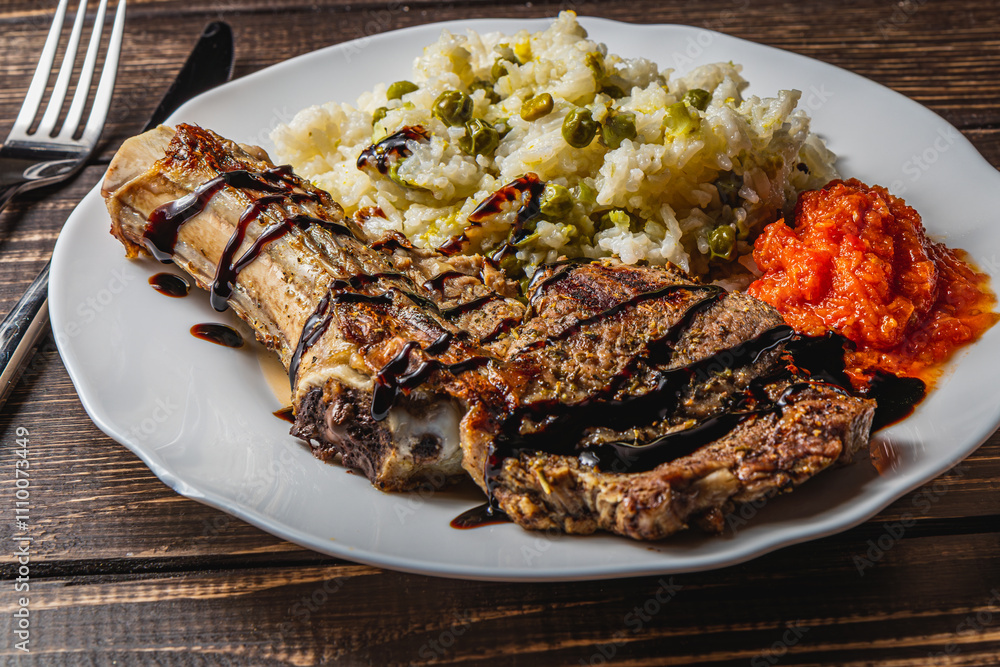 entrecote on the bone with rice and vegetables and spicy tomato sauce entrecote on the bone with rice and vegetables and spicy tomato sauce