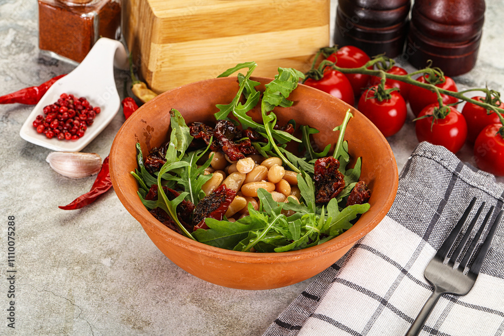 White canned beans with arugula and dry tomatoes White canned beans with arugula and dry tomatoes