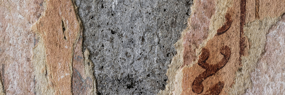 Torn old faded paper wallpaper with a retro pattern. Tattered scraps of paper on a concrete wall. Vintage texture for background and design. Closeup view with copy space. Torn old faded paper wallpaper with a retro pattern. Tattered scraps of paper on a concrete wall. Vintage texture for background and design. Closeup view with copy space.