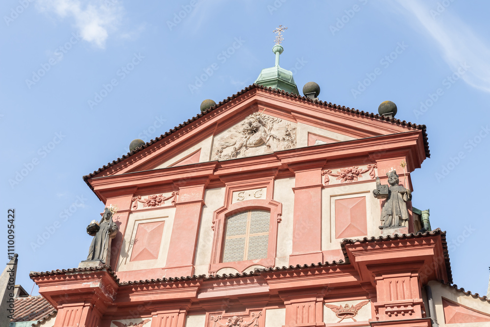The top of St Georges Basilica in Third courtyard of Prague Castle near St Vitus Cathedral in Prague in Czech Republic The top of St Georges Basilica in Third courtyard of Prague Castle near St Vitus Cathedral in Prague in Czech Republic