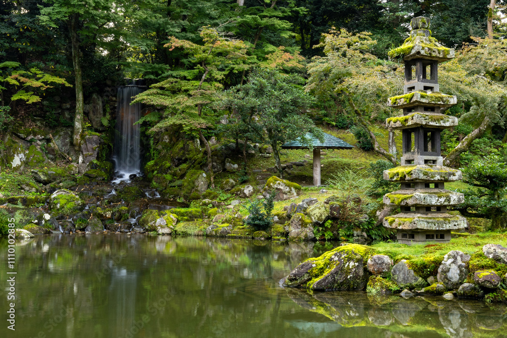 Japanese garden with waterfall and lantern. Japanese garden with waterfall and lantern.