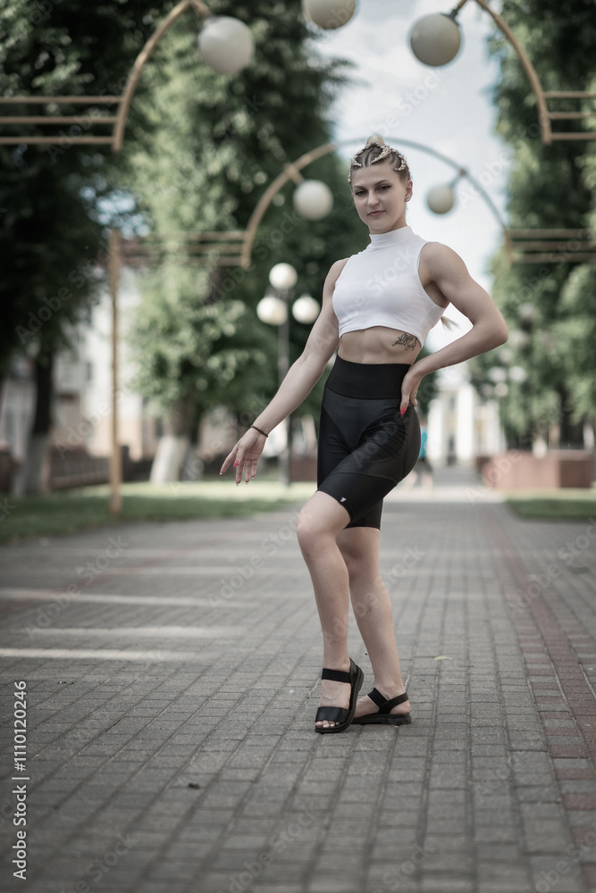 Portrait of a young beautiful athletic girl in the summer outdoors. Portrait of a young beautiful athletic girl in the summer outdoors.