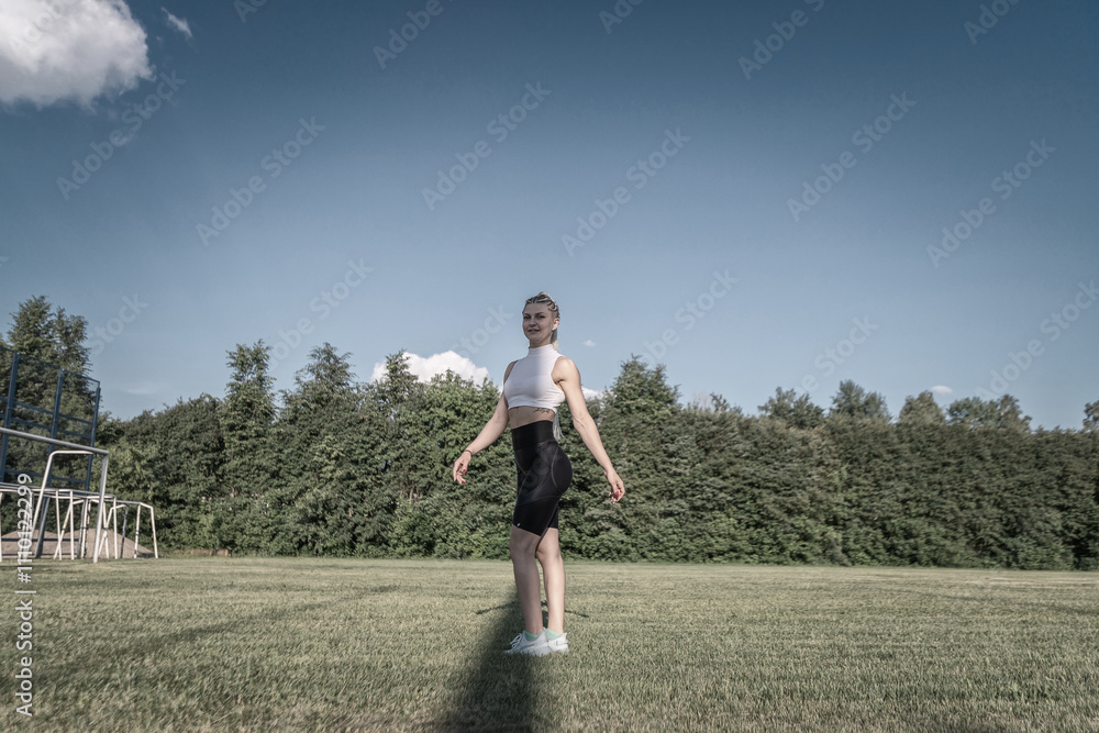 Portrait of a young beautiful athletic girl in the summer outdoors. Portrait of a young beautiful athletic girl in the summer outdoors.