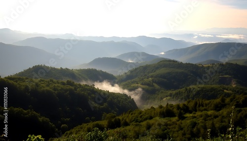 Misty Mountain Ranges Verdant Hills Foggy Valleys Scenic View.Layers of mountains create a dramatic peaceful landscape.