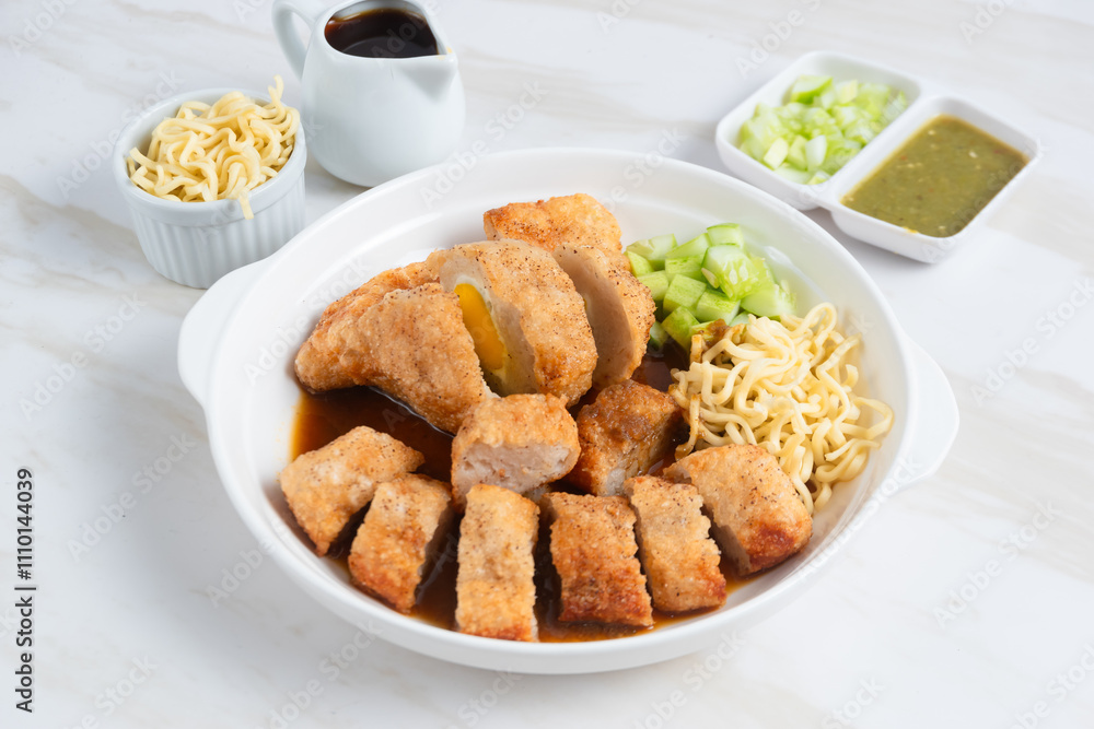 Pempek, traditional food from South Sumatra, Indonesia. This fish-based food is very popular. Served with cuko sauce and cucumber slices. Perfect for recipe, article, catalogue. Pempek, traditional food from South Sumatra, Indonesia. This fish-based food is very popular. Served with cuko sauce and cucumber slices. Perfect for recipe, article, catalogue.