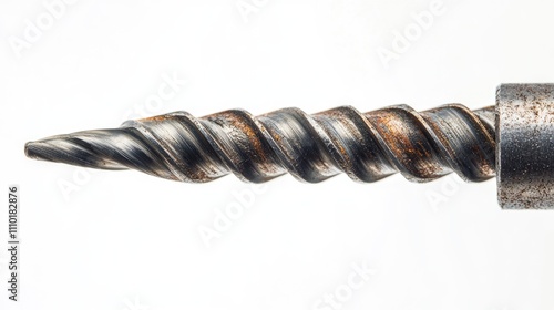 Metal drill bit with spiral flutes close up on white background showcasing details and texture of the tool for industrial and DIY applications photo