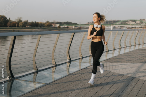 Joyful jogger enjoying a mo...