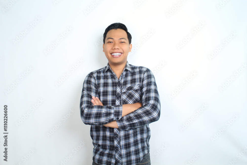 Fototapeta premium smiling asian man crossed arm show cheerful expression isolated on white background