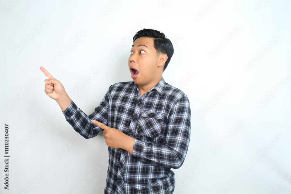 shocked asian man pointing finger with scared face isolated on white wearing casual shirt shocked asian man pointing finger with scared face isolated on white wearing casual shirt