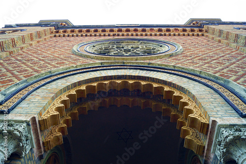 Tourist attractions in Timisoara Old Town: facade of the historical monument of Romania, Cetate Synagogue. Beautiful exterior of the temple in eclectic style with rose window and ornamentation photo