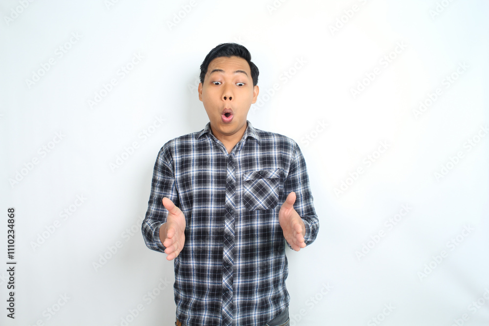 surprised asian man presenting hand to copy space with funny face shocked expression isolated on white surprised asian man presenting hand to copy space with funny face shocked expression isolated on white