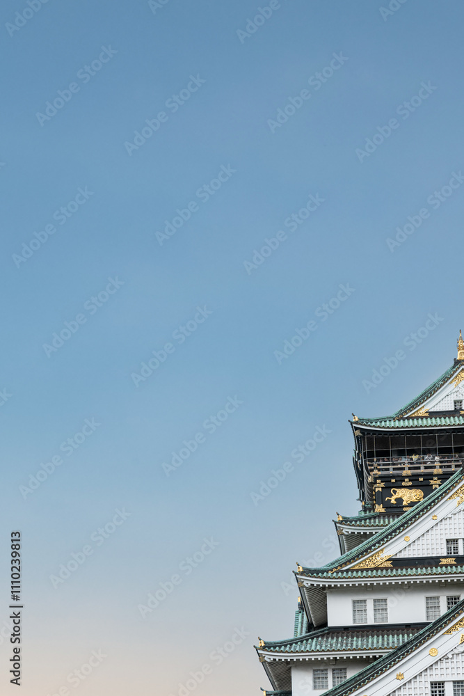 Left side of Minimalist Osaka Castle with clear sky in autumn Left side of Minimalist Osaka Castle with clear sky in autumn