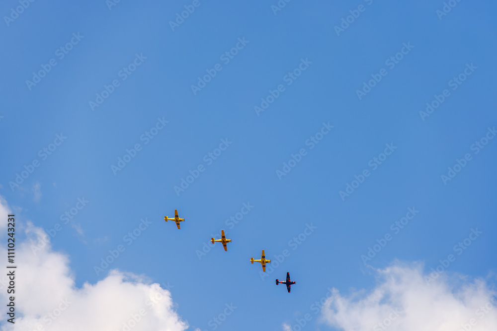 Airplanes flying in formation on a blue sky Airplanes flying in formation on a blue sky