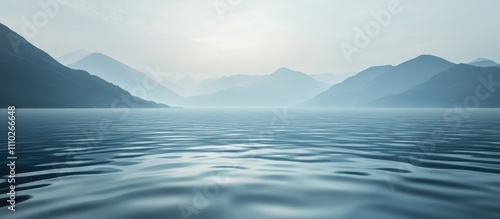 Serene deep blue ocean landscape with distant mountains under a soft horizon sky creating a tranquil coastal atmosphere