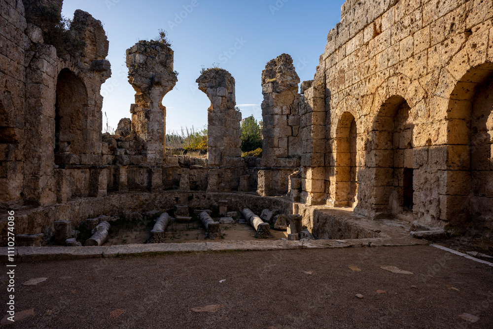 Rows of columns in Perge, Antalya, Turkey. Remains of colonnaded street in Pamphylian ancient city.Rows of columns in Perge, Antalya, Turkey. Ancient Kestros Fountain. Aksu, Antalya
