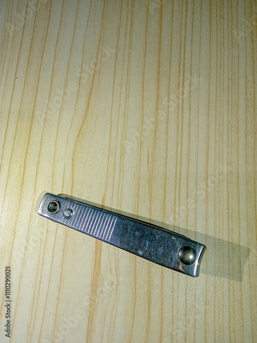 Portrait of a nail clipper on a table photo