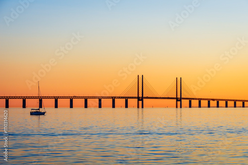 Sunset view of the Oresund bridge from the swedish shore, a railway and motorway cable-stayed bridge across the Oresund strait between Denmark and Sweden, opened to traffic in 2000.