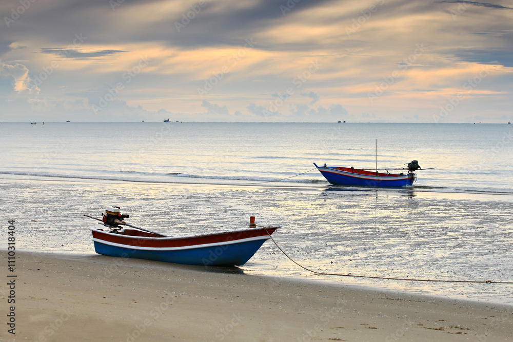 Fishing boat in sunrise background at Pranburi beach, Prachuap Khiri Khan Province, Thailand Fishing boat in sunrise background at Pranburi beach, Prachuap Khiri Khan Province, Thailand
