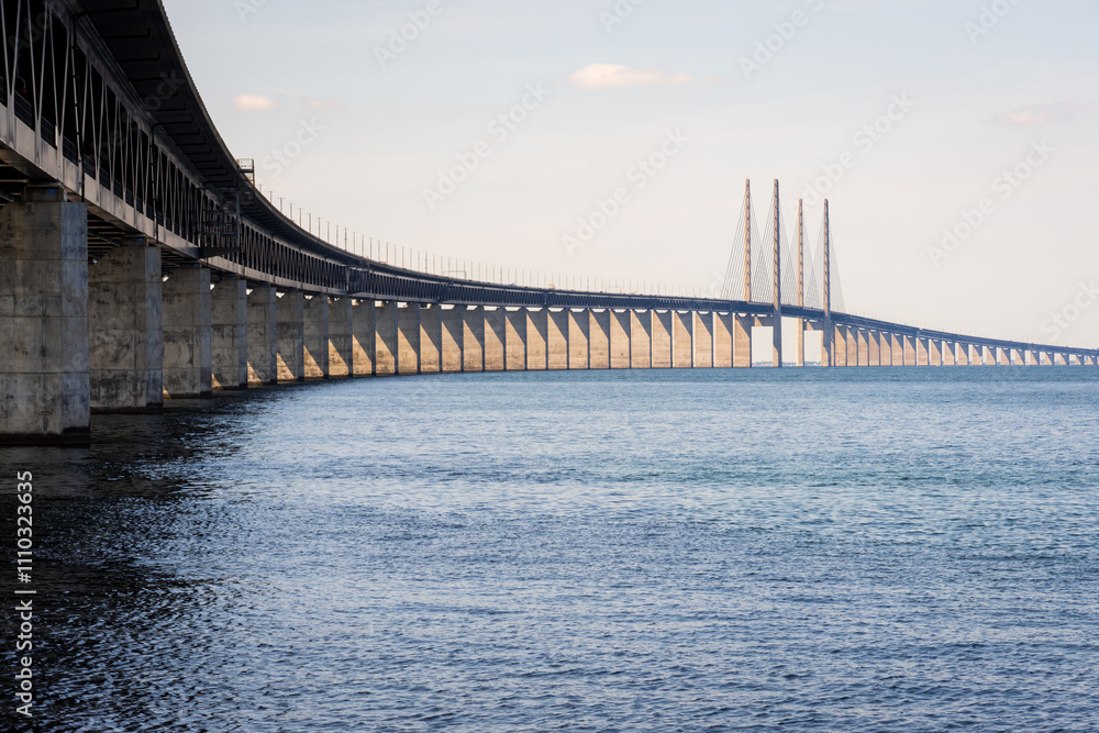The Oresund bridge, seen from the swedish shore, is a railway and motorway cable-stayed bridge across the Oresund strait between Denmark and Sweden, opened to traffic in 2000. The Oresund bridge, seen from the swedish shore, is a railway and motorway cable-stayed bridge across the Oresund strait between Denmark and Sweden, opened to traffic in 2000.