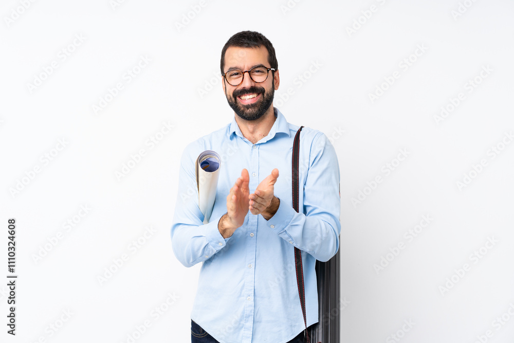 Young architect man with beard over isolated white background applauding after presentation in a conference Young architect man with beard over isolated white background applauding after presentation in a conference