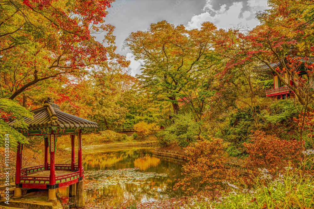 A waterside pavilion located in the secret garden of Changdeokgung Palace during autumn foliage season in Seoul, South Korea. A waterside pavilion located in the secret garden of Changdeokgung Palace during autumn foliage season in Seoul, South Korea.