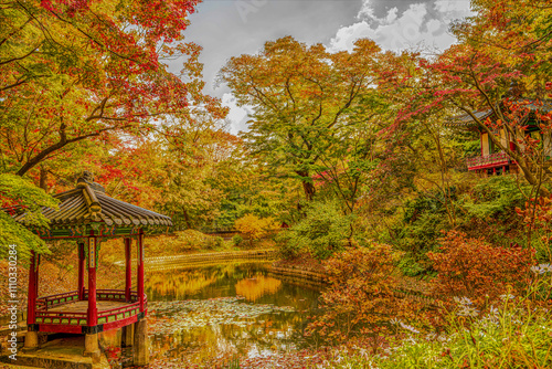 A waterside pavilion located in the secret garden of Changdeokgung Palace during autumn foliage season in Seoul, South Korea. photo