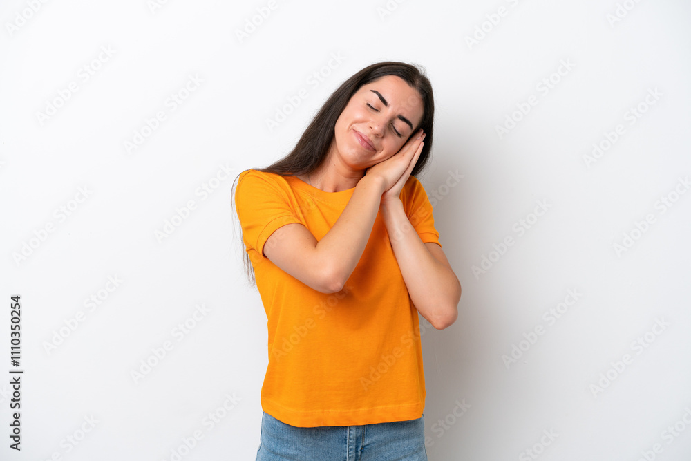 Young caucasian woman isolated on white background making sleep gesture in dorable expression Young caucasian woman isolated on white background making sleep gesture in dorable expression