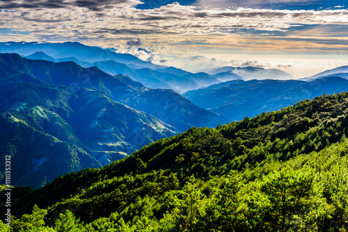  In the morning, layers of magnificent mountains and clear clouds background in Taiwan.
