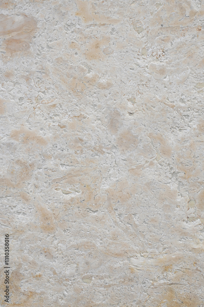 Light beige travertine stone wall with marbled texture as vertical background Light beige travertine stone wall with marbled texture as vertical background