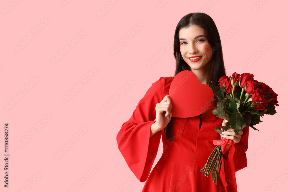 Beautiful young woman with kiss marks on her face holding bouquet of roses and red paper heart on pink background Beautiful young woman with kiss marks on her face holding bouquet of roses and red paper heart on pink background