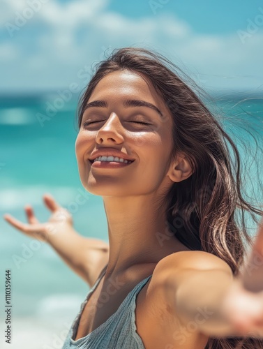 Smiling latin hispanic woman stretching hand and relaxing on beach. Woman breathing deeply at seaside with eyes closed. Happy woman standing on the beach and enjoy the sun tan with arms outstretched. photo