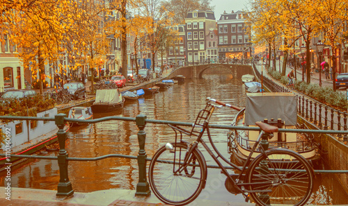 Photography Evening autumn streets and canals of Amsterdam. Bicycles.