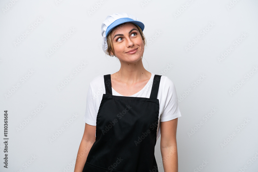 Fishwife woman isolated on white background thinking an idea while looking up Fishwife woman isolated on white background thinking an idea while looking up