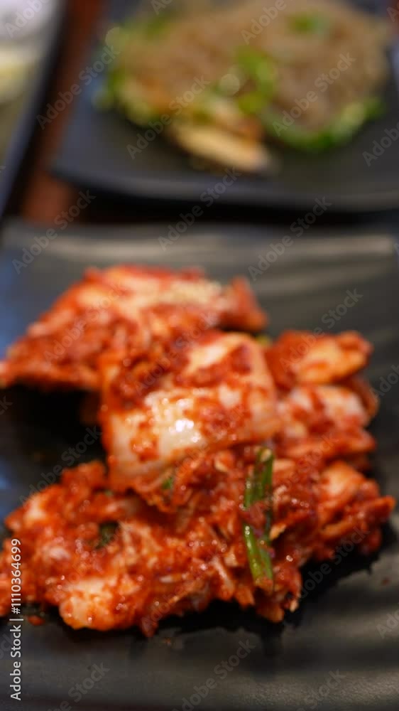 Closeup View of Person Using Chopsticks to Eat Kimchi. Vertical Footage Closeup View of Person Using Chopsticks to Eat Kimchi. Vertical Footage