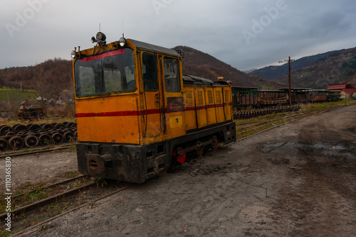 Rustic train and scenic landscape of Maramures, Romania photo