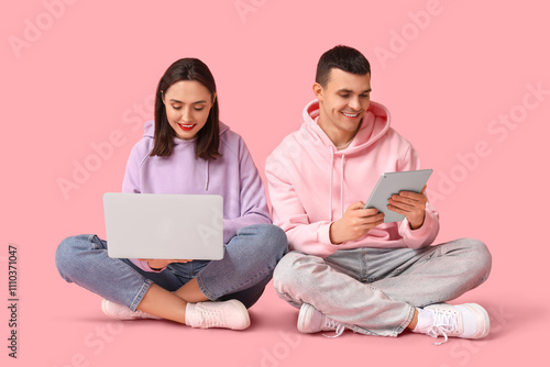 Young couple with laptop an...