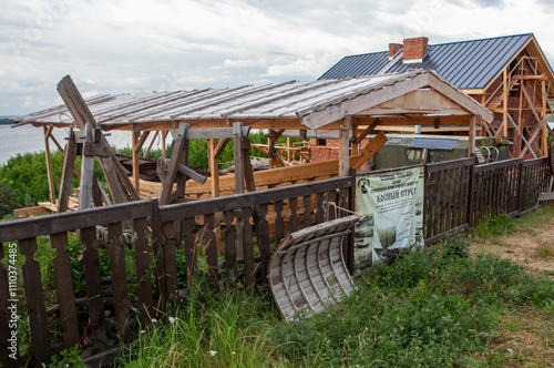 A rustic wooden building takes shape near the riverbanks of Sviyazhsk, showcasing local craftsmanship and charm. photo