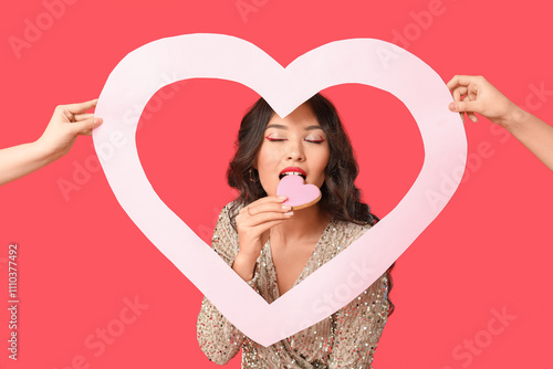 Young woman eating heart-sh...