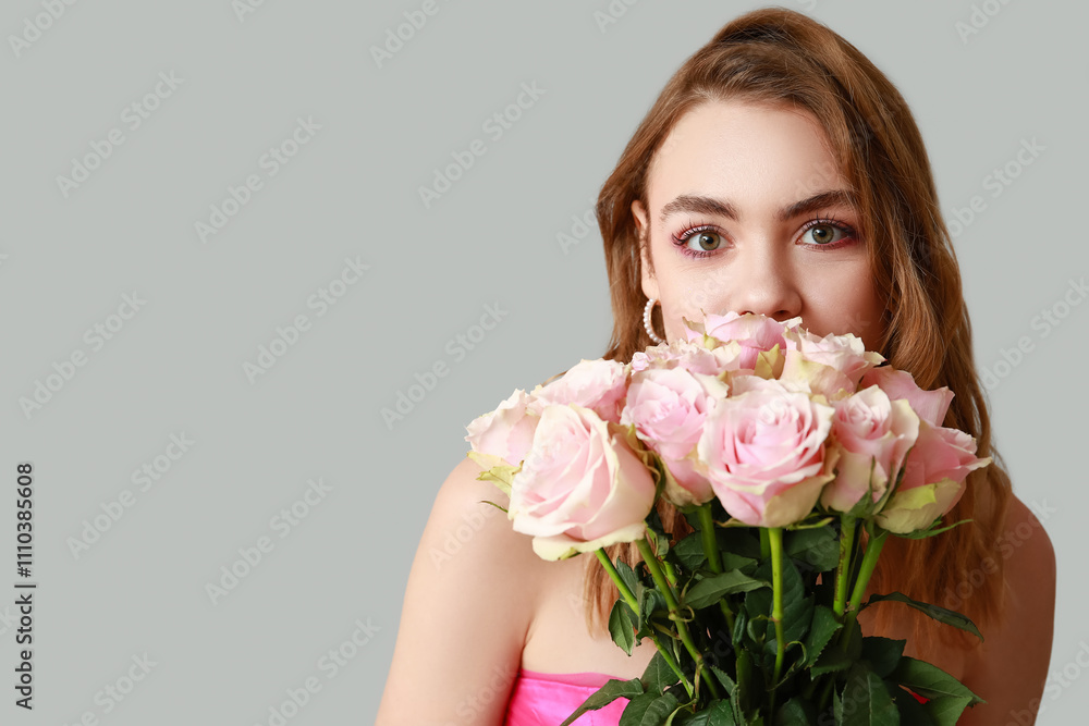Young woman with roses on light background, closeup. Valentine's Day celebration Young woman with roses on light background, closeup. Valentine's Day celebration